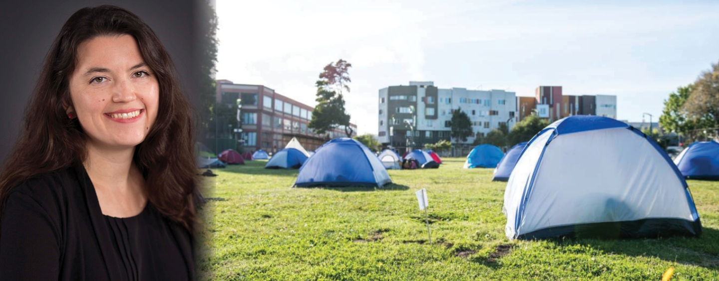 Dilara Yarbrough beside cloth tents